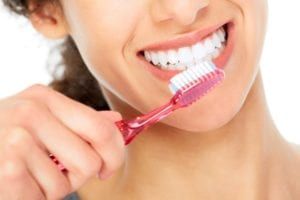 Closeup of a woman brushing her teeth