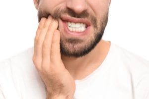 Man suffering from tooth pain